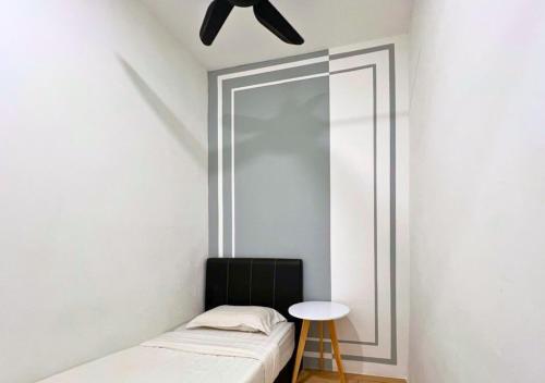 a bedroom with a mirror and a bed and a stool at ITCC Manhattan by IGVC in Penampang