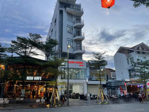 a kite is flying in front of a tall building at Rang Dong Hue Hotel in Hue