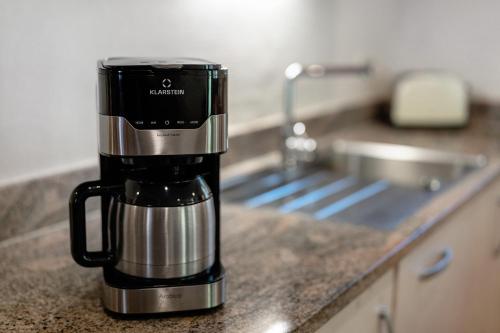 a coffee maker sitting on a counter in a kitchen at Müllerleile Hof in Haslach im Kinzigtal