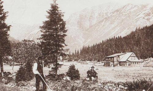an old photo of two people standing in a field at Horská Bouda v Obřím Dole in Pec pod Snezkou