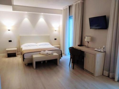 Letto o letti in una camera di Hotel Villa Barsanti