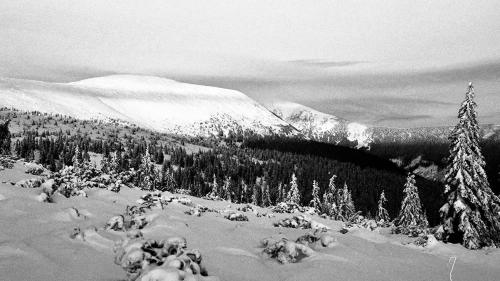 a black and white photo of a snow covered mountain at Horská Bouda v Obřím Dole in Pec pod Snezkou