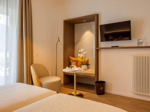 Postel nebo postele na pokoji v ubytování Hotel Walter Au Lac