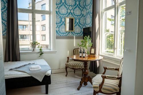 Postel nebo postele na pokoji v ubytování Grand Hotel Lysekil