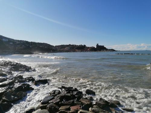 a view of the ocean with rocks in the water at Le Rocce Wellness and Fitness, only adults in Lerici