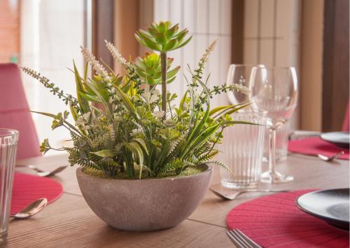 a potted plant sitting on a wooden table at La Arcadia de Portillo in Portillo