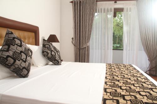 Katil atau katil-katil dalam bilik di Oreeka - Katunayake Airport Transit Hotels