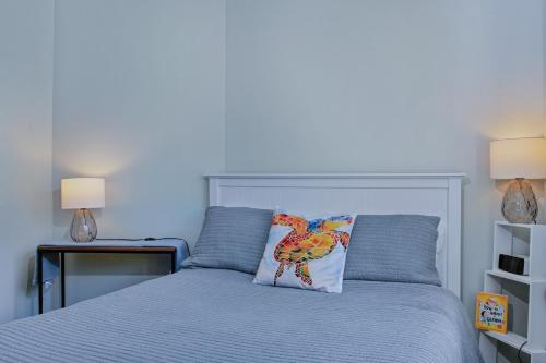 a bedroom with a bed with a bird pillow on it at Fabulous, New, Well Appointed Beach House in Kingston Beach