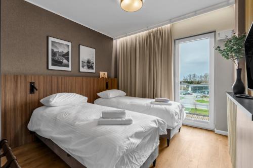 Ένα ή περισσότερα κρεβάτια σε δωμάτιο στο Elegant Beige Harmony Apartment