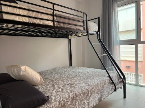 a bunk bed in a room with a bed gmaxwell gmaxwell gmaxwell gmaxwell gmaxwell at Vera Albacora de Luxe in Vera