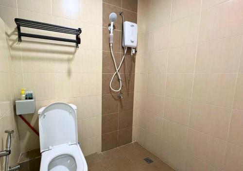 a bathroom with a toilet and a shower at ITCC Manhattan by IGVC in Penampang