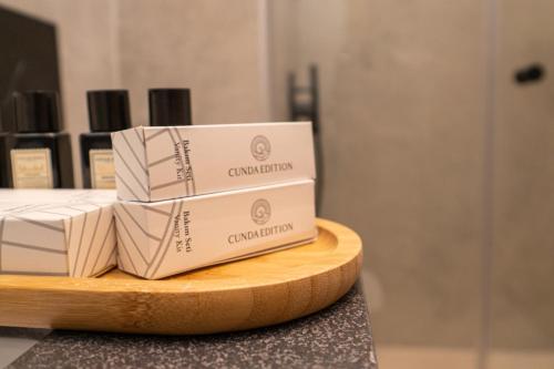 a stack of boxes sitting on a cutting board at Leone Cunda Edition Otel in Ayvalık