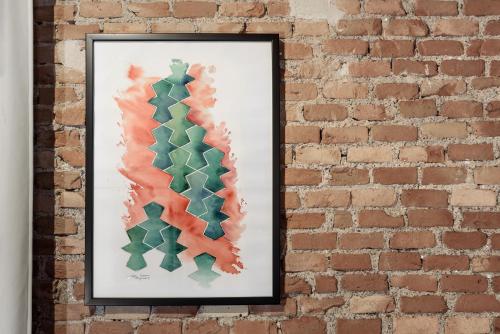 a picture on a brick wall at Hotel La Casa de Los Mosaicos by Maxi Hoteles in Granada