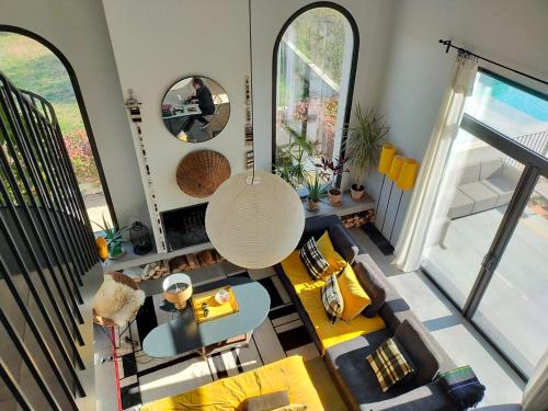 an overhead view of a living room with a couch at Mas de charme au pied des Alpilles in Maussane-les-Alpilles
