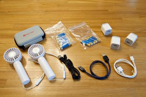 a group of electronic items on a wooden table at アーモンド石垣 in Tunugusuku