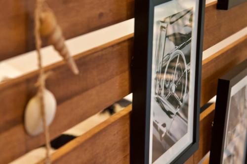 a framed picture of a bike on a shelf at アーモンド石垣 in Tunugusuku