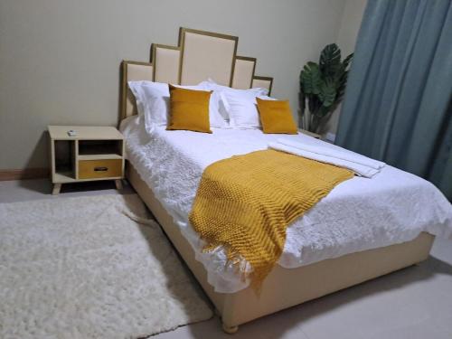 Llit o llits en una habitació de Oak Residence 1
