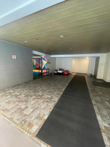 an empty room with a large room with a large floor at Antel Spa Residences 2505 in Manila