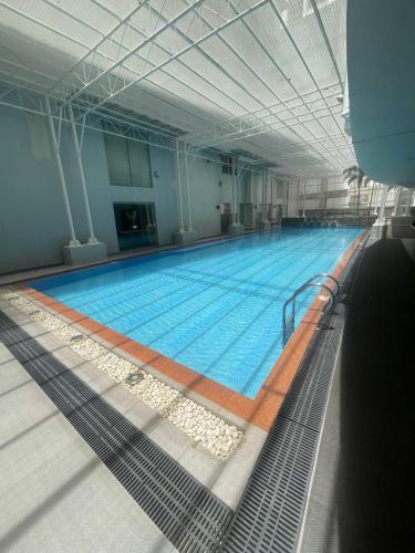 a large swimming pool in a large building at Antel Spa Residences 2505 in Manila