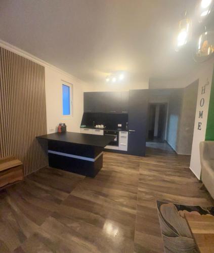 a living room with a flat screen tv and a couch at Stan na dan Markovic in Bar, Susanj