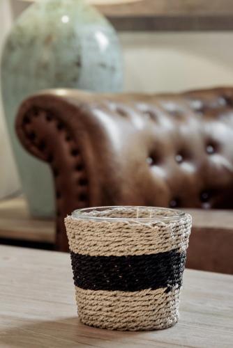 a basket sitting on a table next to a couch at Hotel La Casa de Los Mosaicos by Maxi Hoteles in Granada