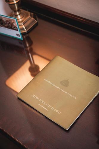 a laptop sitting on top of a wooden table at Old Swan Hotel in Harrogate