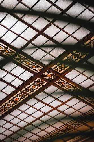 a ceiling of a building with gold and white ceilings at Old Swan Hotel in Harrogate