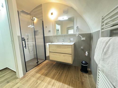 a bathroom with a sink and a shower at Aquila in Arco