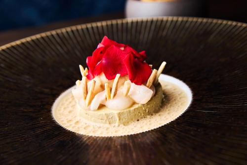 a dessert sitting on a plate on a table at Hotel Detmolder Hof in Detmold