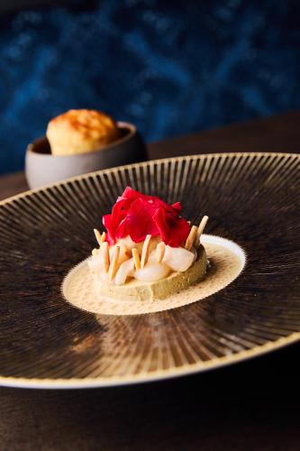 a dessert on a plate on a table at Hotel Detmolder Hof in Detmold