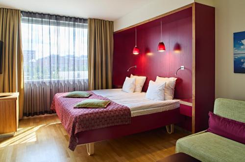 Ένα ή περισσότερα κρεβάτια σε δωμάτιο στο Original Sokos Hotel Alexandra Jyväskylä
