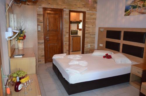 a bedroom with a large bed in a room at Penzion Blo in Panormos Skopelos