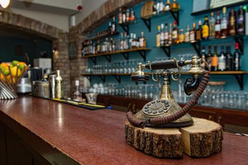 a telephone sitting on top of a bar at Porto Resort in Lilaste
