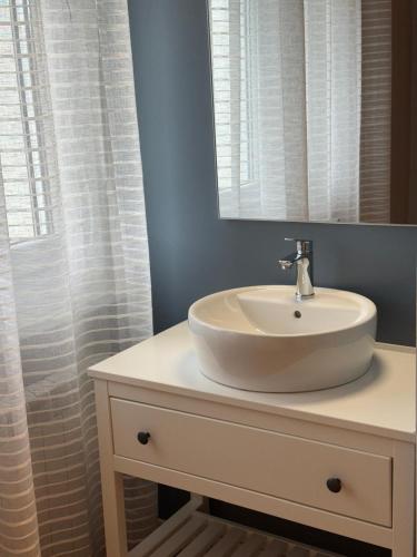 a bathroom with a sink and a mirror at Bed and Breakfast Cattinara in Trieste