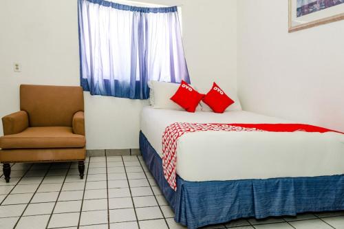 Ένα ή περισσότερα κρεβάτια σε δωμάτιο στο OYO Hotel Cabo Del Sur, Cabo San Lucas