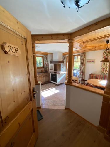 a kitchen and living room in a house at Hotel Berghof in Zermatt