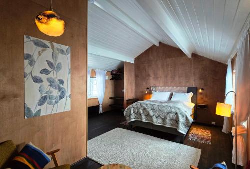 a hotel room with a bed and a window at ONGA Boutique Lodge in Alta