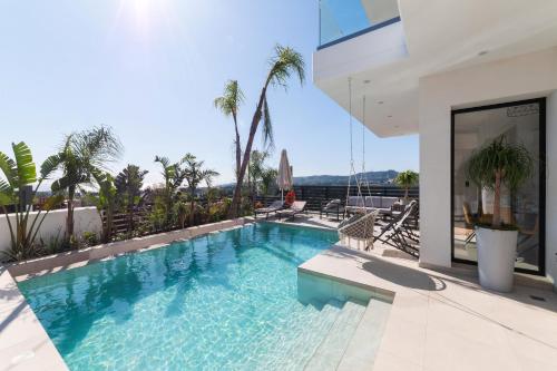 a swimming pool on the roof of a house at Blue Hills Villa in Kallithea Rhodes