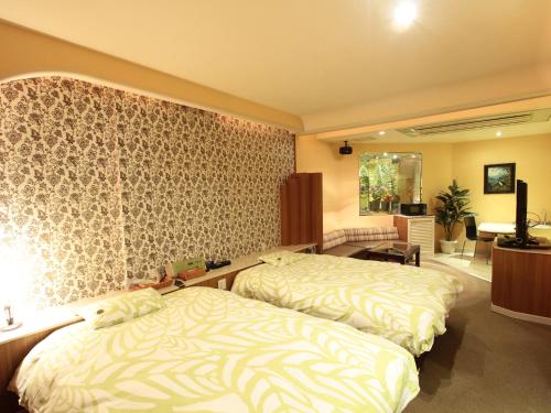 Postel nebo postele na pokoji v ubytování G HOTEL 一宮 -Hotel & Resorts-