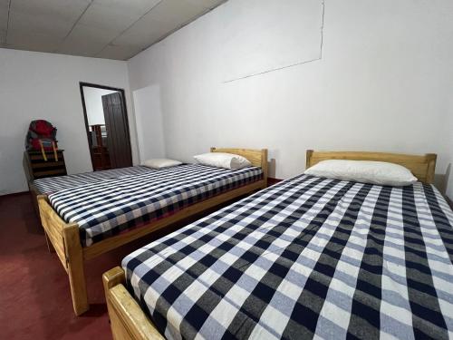 Postel nebo postele na pokoji v ubytování Gleeful Hostel