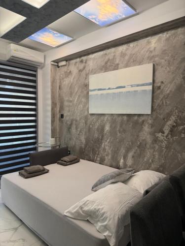 Ένα ή περισσότερα κρεβάτια σε δωμάτιο στο Afoi Hasalla Apartments 2