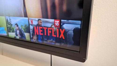 a television with a netflix sign on it at Pretty private Apartment U LABE, self-service check-in 24 l 7 in Neratovice