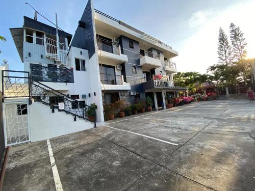 an empty parking lot in front of a building at Rangya Hotel in Tagaytay