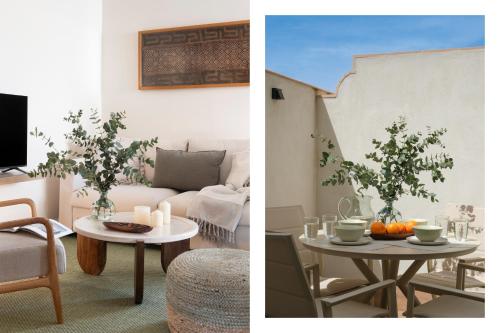 a living room with a couch and a table with oranges at Magno Apartments Altozano I in Seville