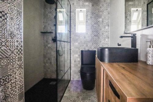a bathroom with a sink and a toilet and a shower at 2 Vale de Ursa - Swimming Pool - WIFI - BY BEDZY in Guia