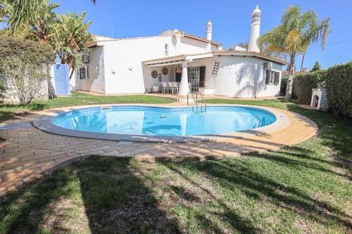 a swimming pool in front of a house at 2 Vale de Ursa - Swimming Pool - WIFI - BY BEDZY in Guia