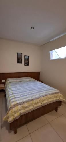 a bedroom with a large bed in a room at Hotel Plaza Olido in Sao Paulo