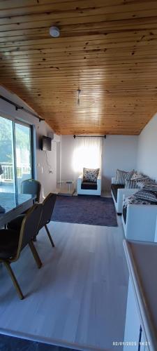 a living room with a bed and a couch at Likya Vadi Evleri Nature and tranquility in Antalya