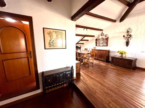 a room with a wooden door and a dining room at Attic Lagoon View in Lido