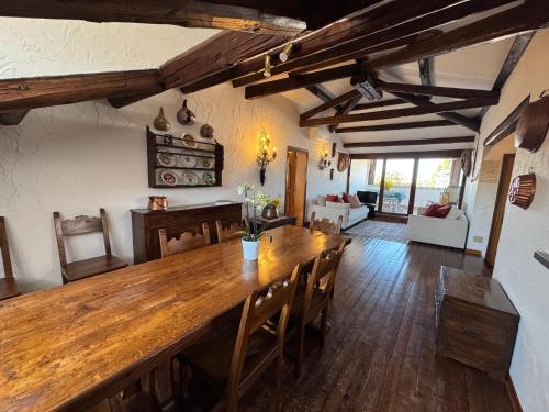 a dining room with a large wooden table and chairs at Attic Lagoon View in Lido